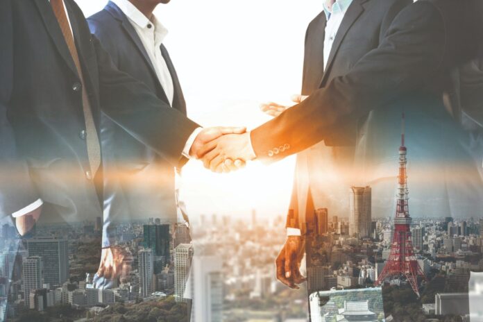 Double exposure Business People Handshake Meeting